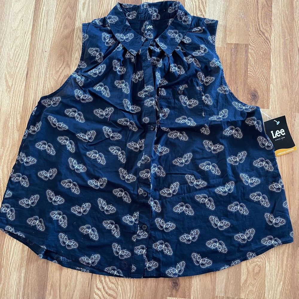 This tank is 2XL Lee brand new with tags. It’s a light cotton with butterflies.